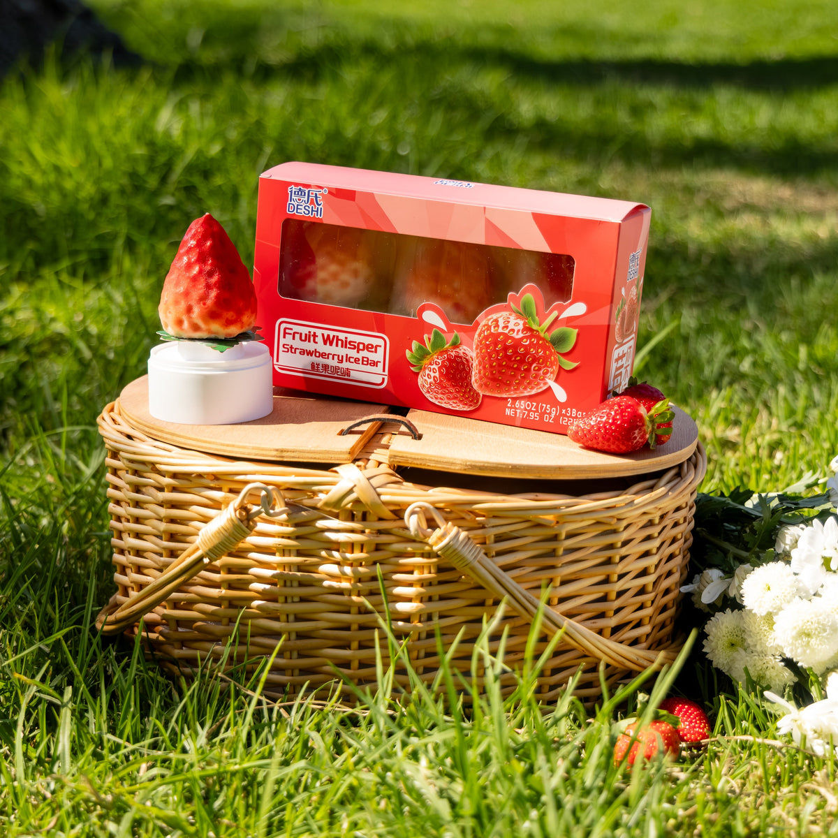Deshi Strawberry ice bars and packaging at a picnic