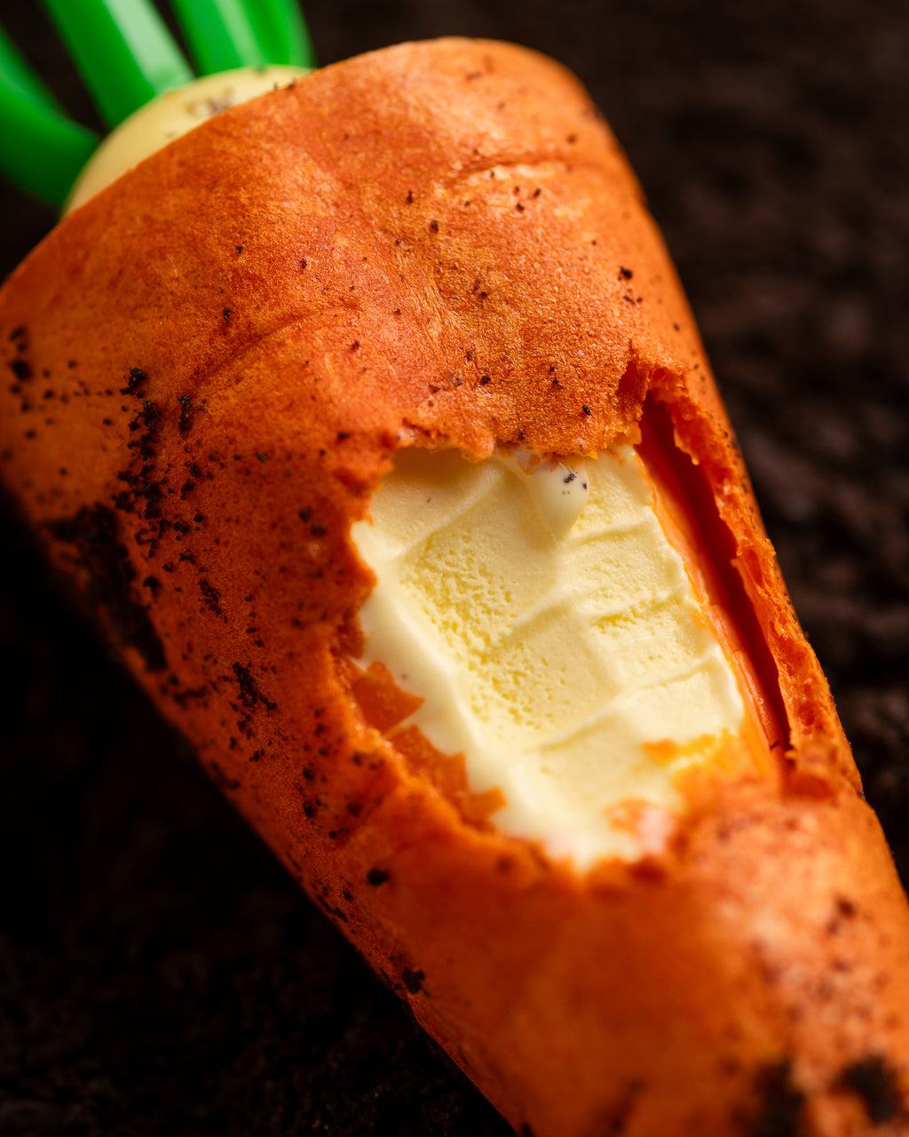 Macro view of the orange wafer cone and butter milk-flavored filling of NiceMe Carrot Ice Cream.