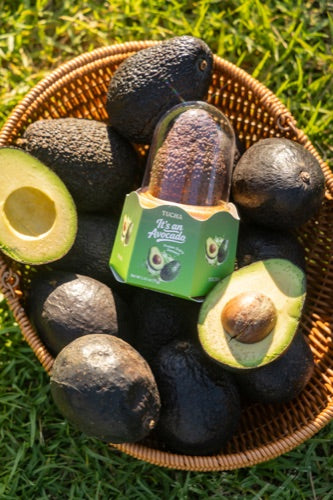 Tu Cha Avocado in a picnic basket with avocados